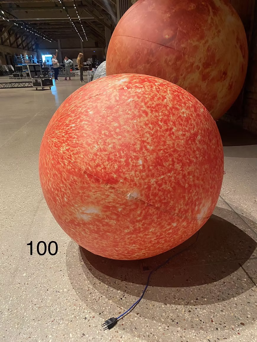 Inflatable orange mini planet