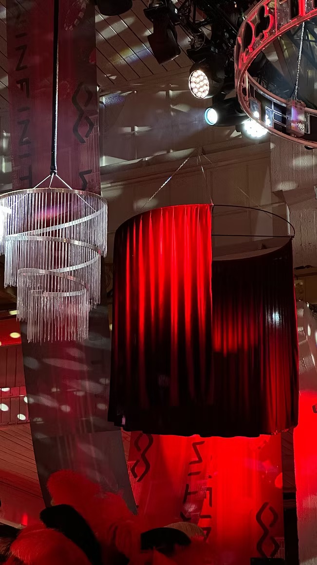 Red velour drapery for chandeliers