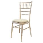 Wooden chair with different pillow colors