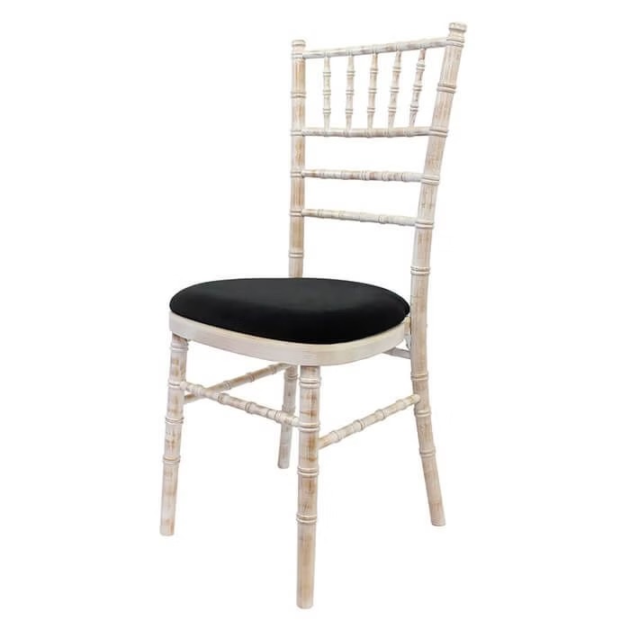 Wooden chair with different pillow colors