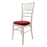 Wooden chair with different pillow colors