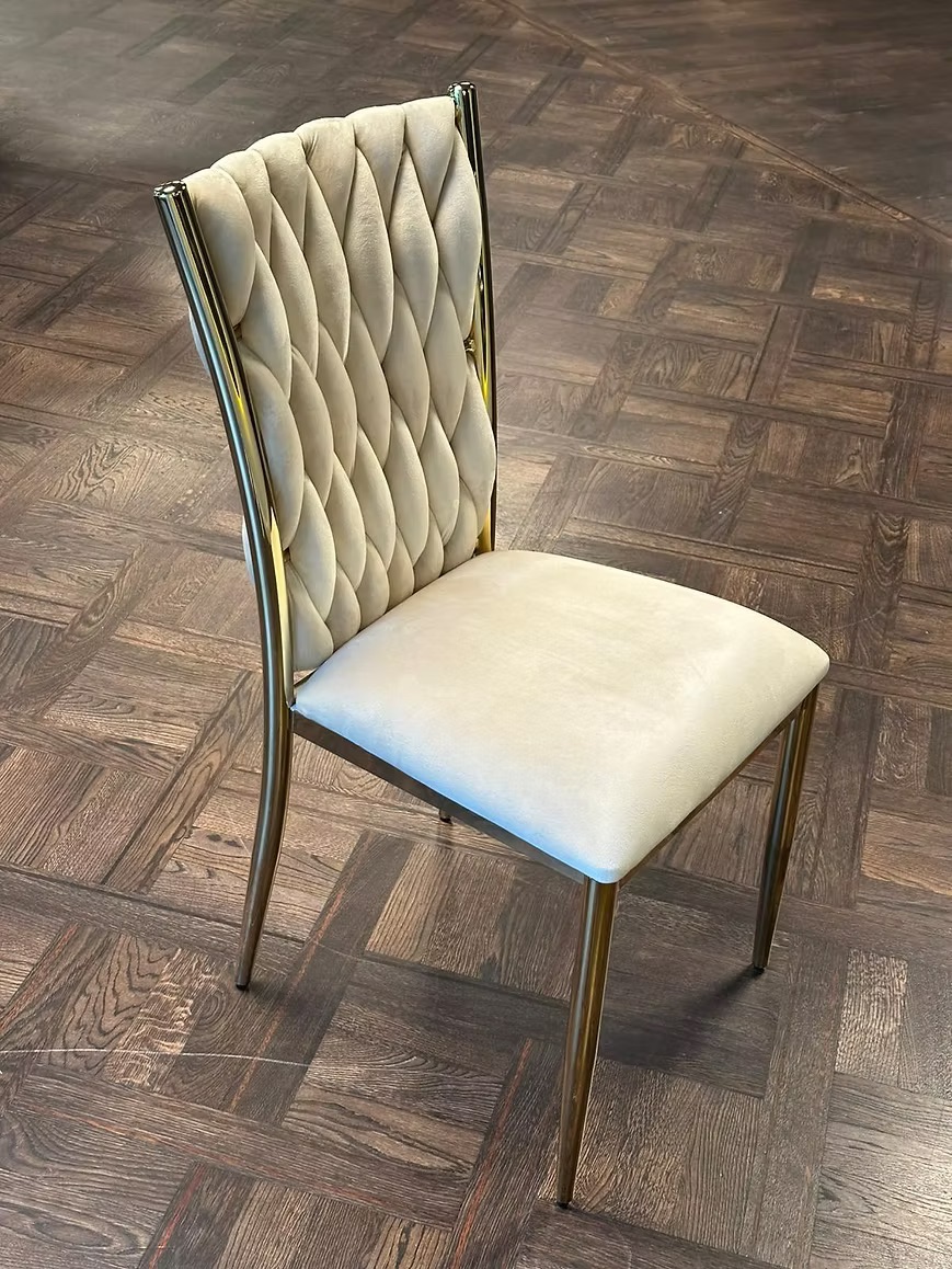 Golden chair with a beige pillow