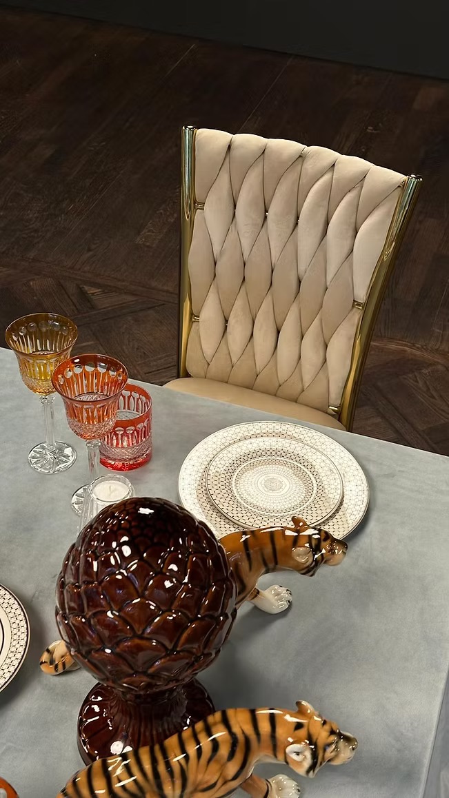 Golden chair with a beige pillow