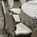 Silver chair with white cushion