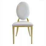 Gold chair with white cushion
