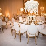 Gold chair with white cushion