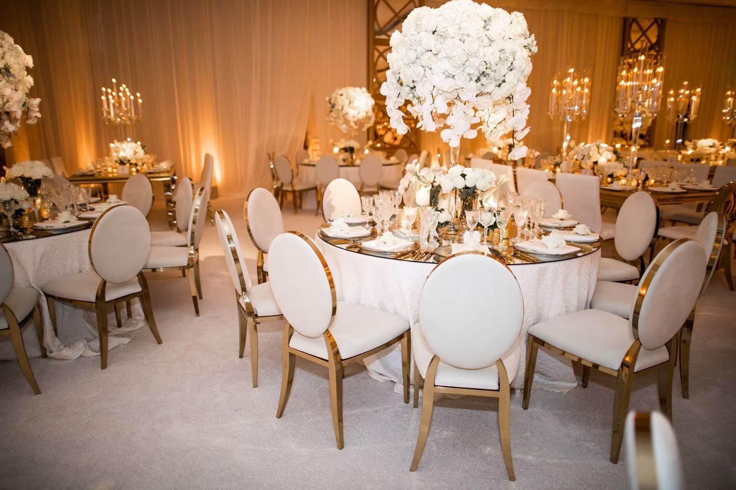 Gold chair with white cushion