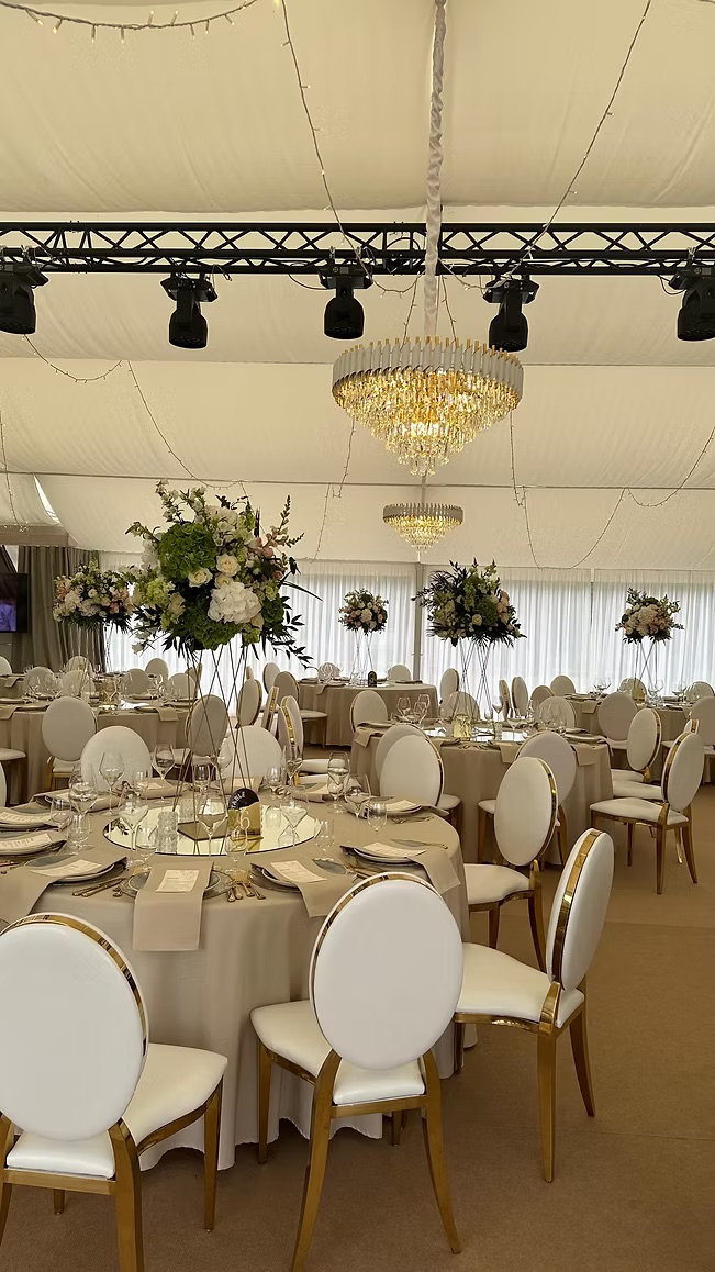 Gold chair with white cushion