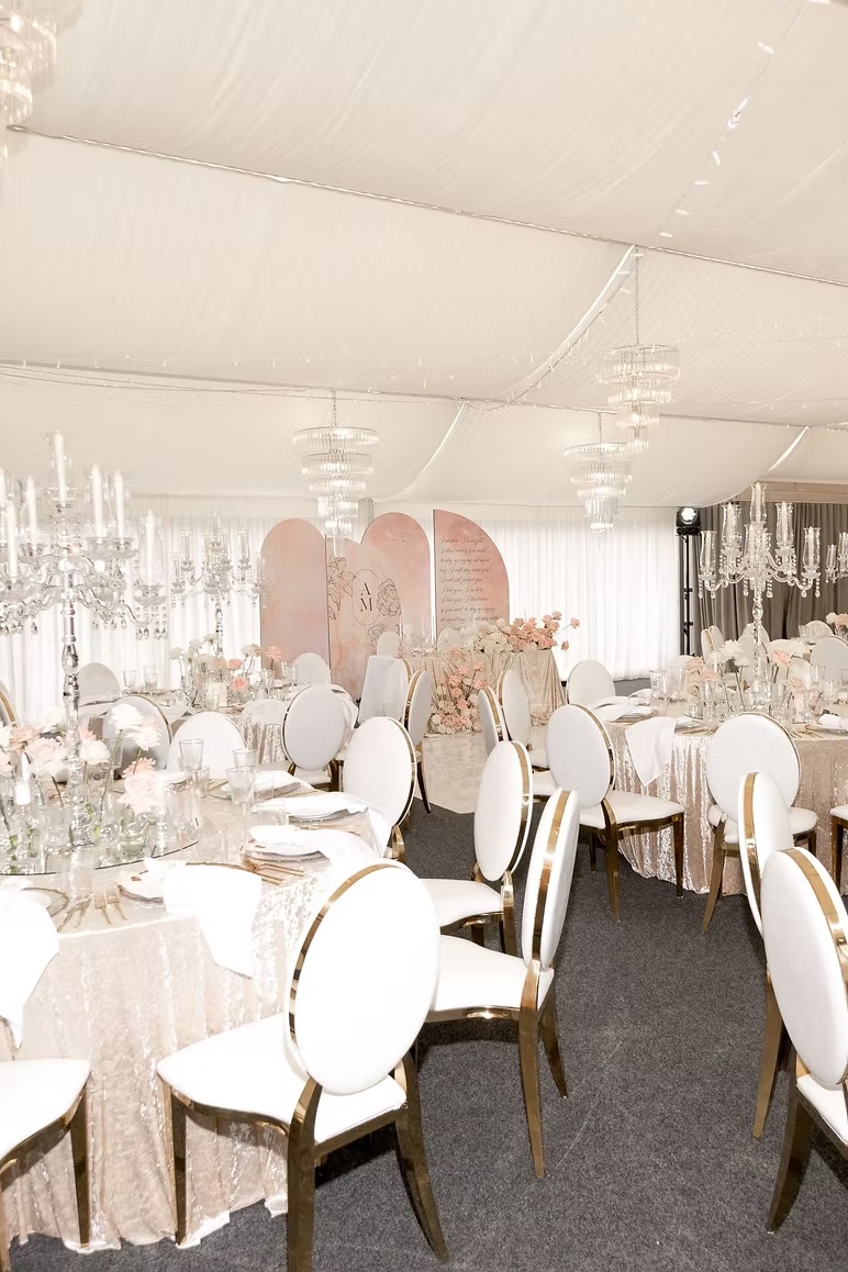 Gold chair with white cushion