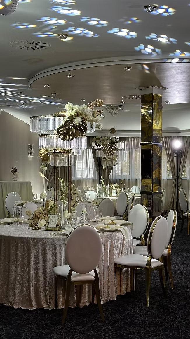 Gold chair with white cushion