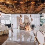 Gold chair with white cushion