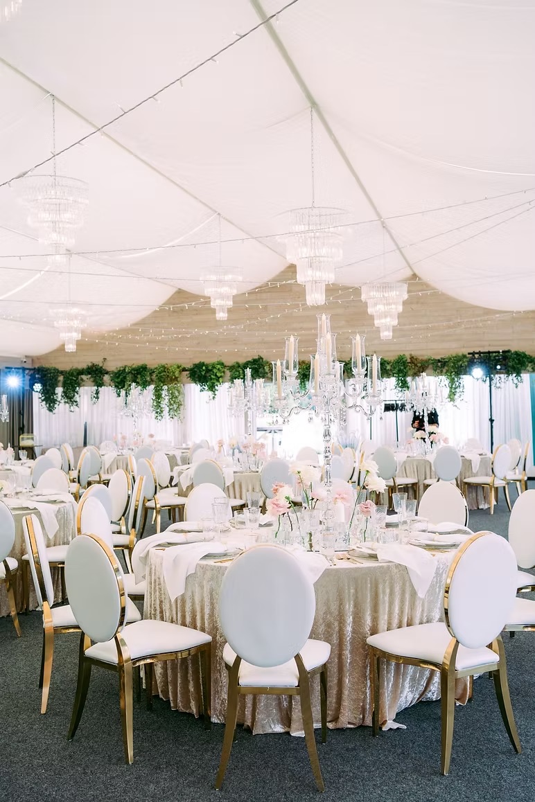 Gold chair with white cushion