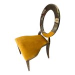 Gold chair with amber cushion