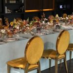 Gold chair with amber cushion