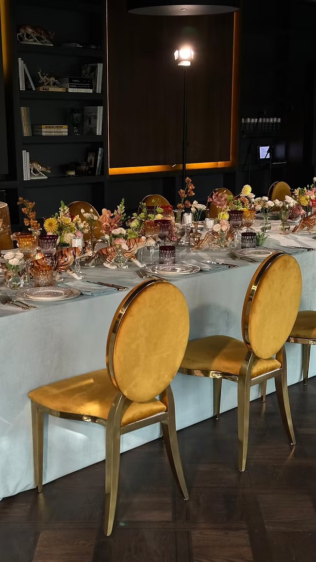 Gold chair with amber cushion