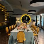 Gold chair with amber cushion