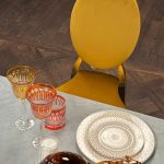 Gold chair with amber cushion