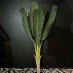 Artificial palm tree with large leaves