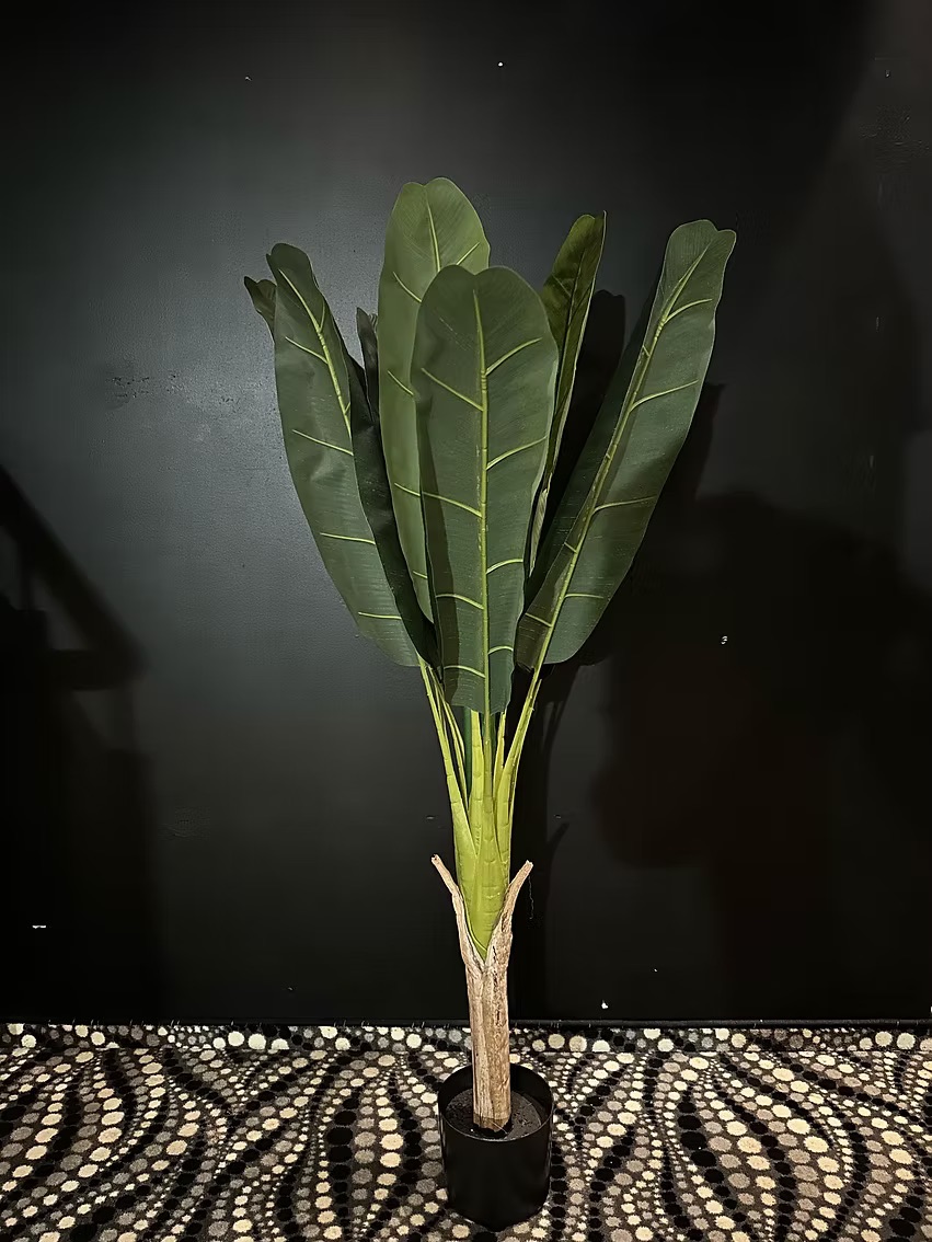 Artificial palm tree with large leaves