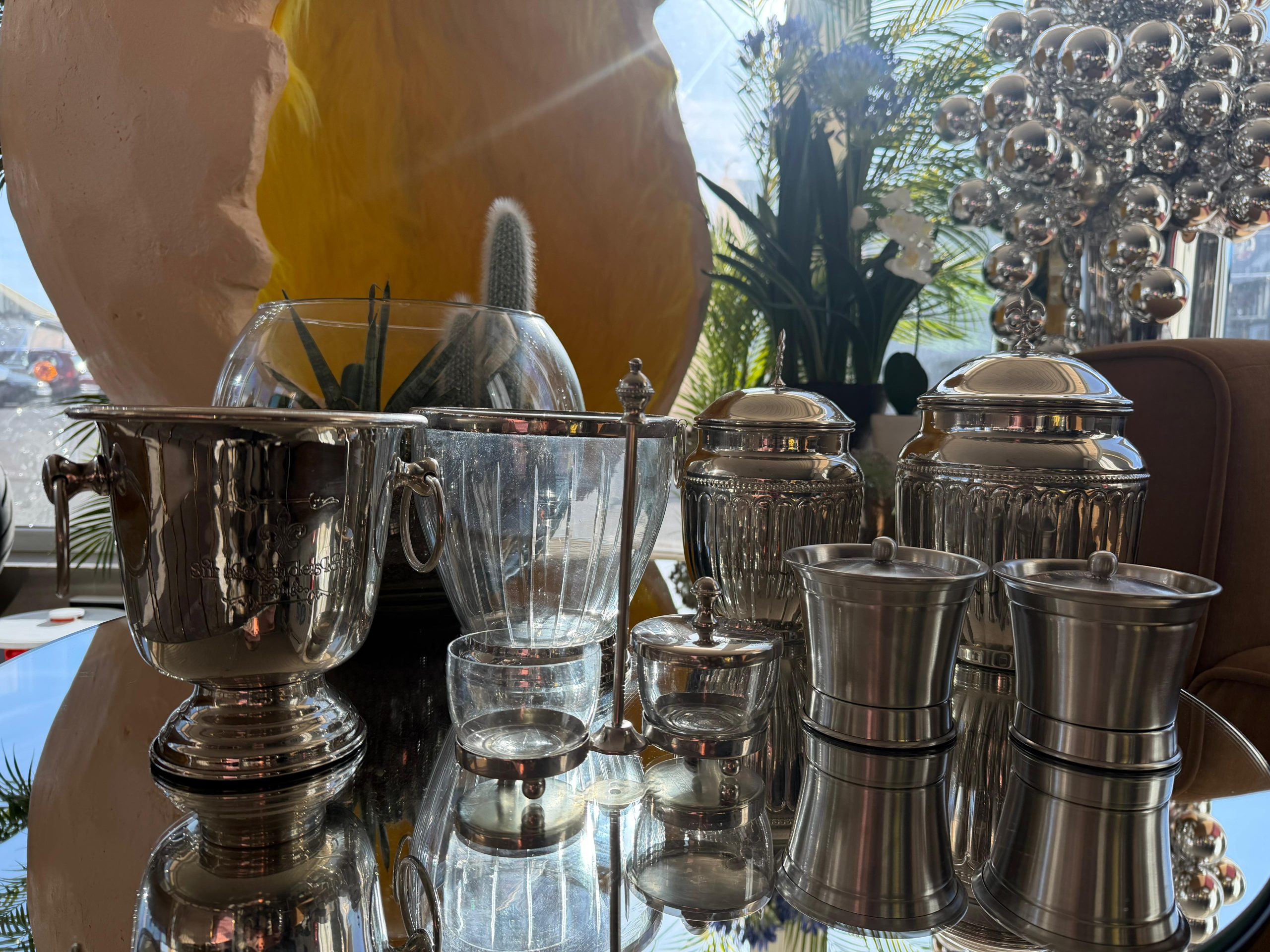 Glass containers with metal holder