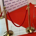 Gold barrier with red ribbon