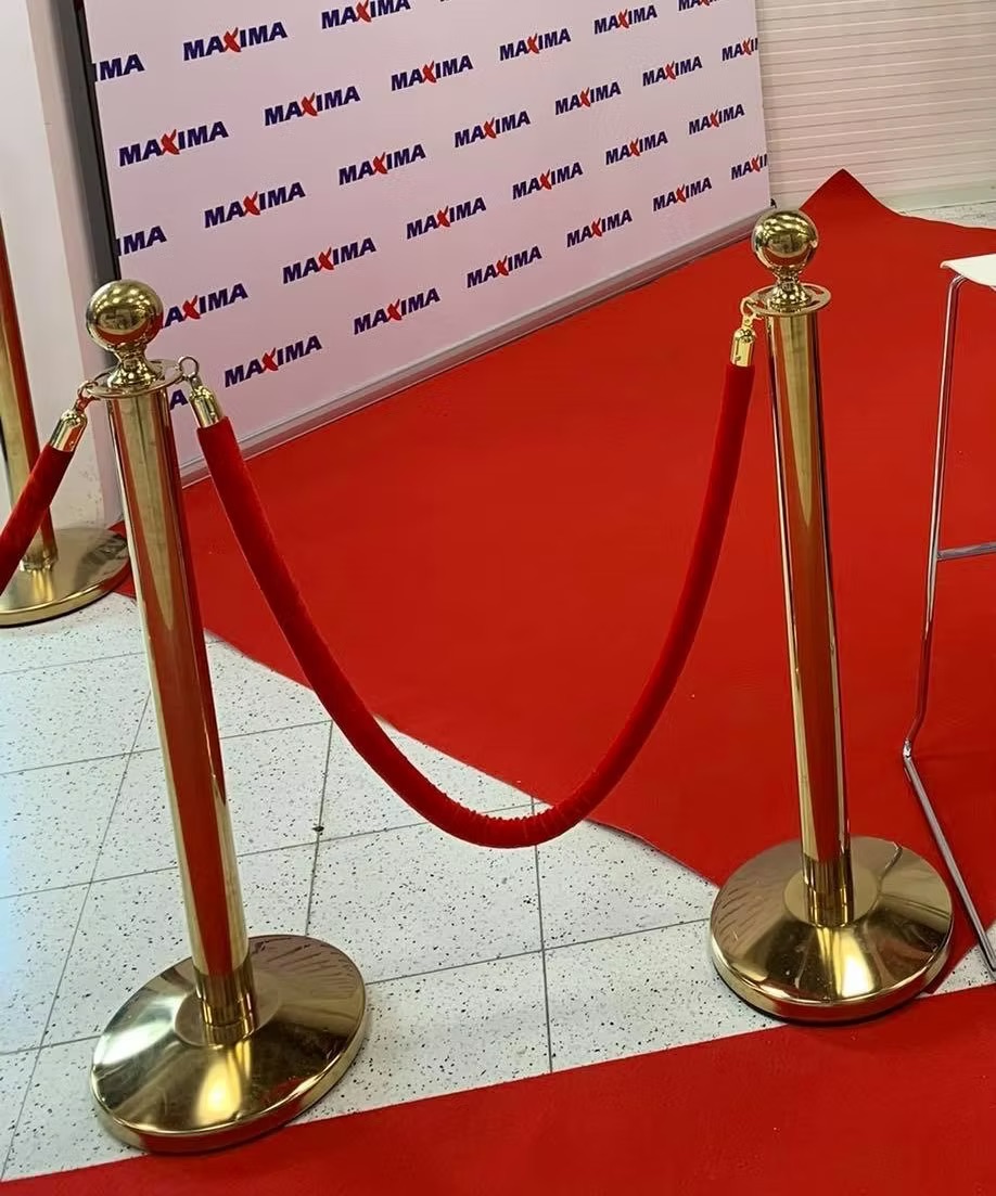 Gold barrier with red ribbon